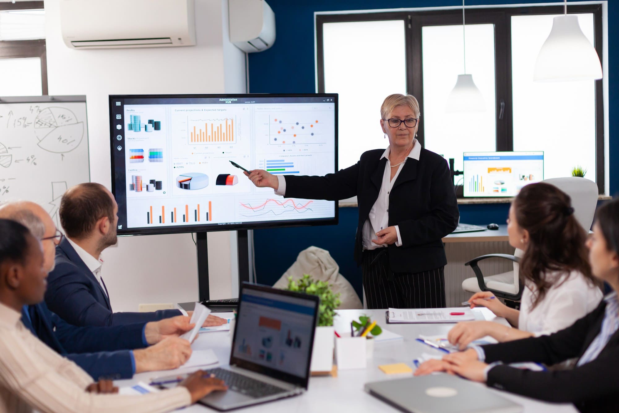 Financial services professional reviewing a digital dashboard